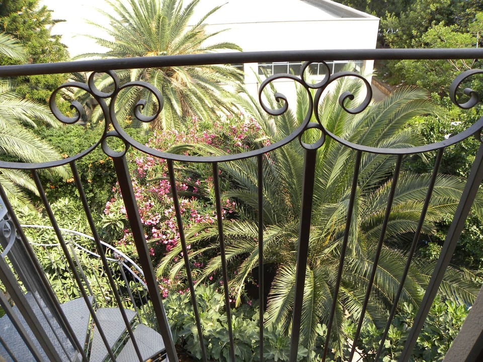 View of the garden and the mountains from the bedroom balcony