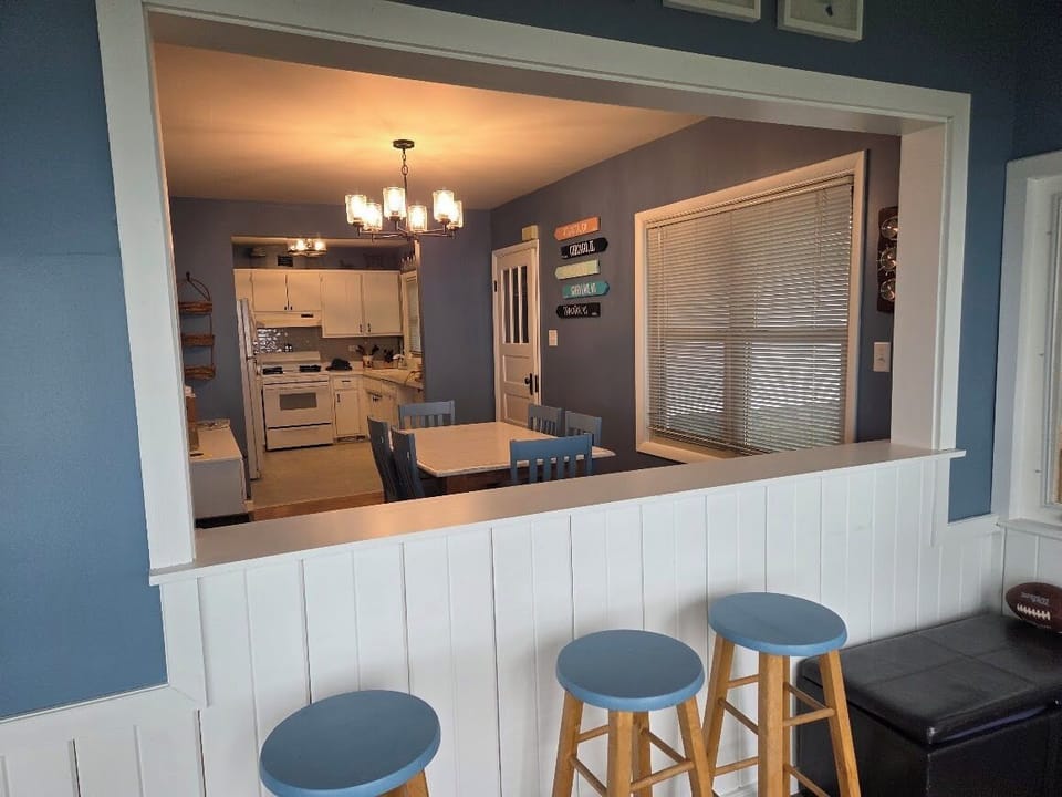 Ample seating at the dining table and breakfast bar.
