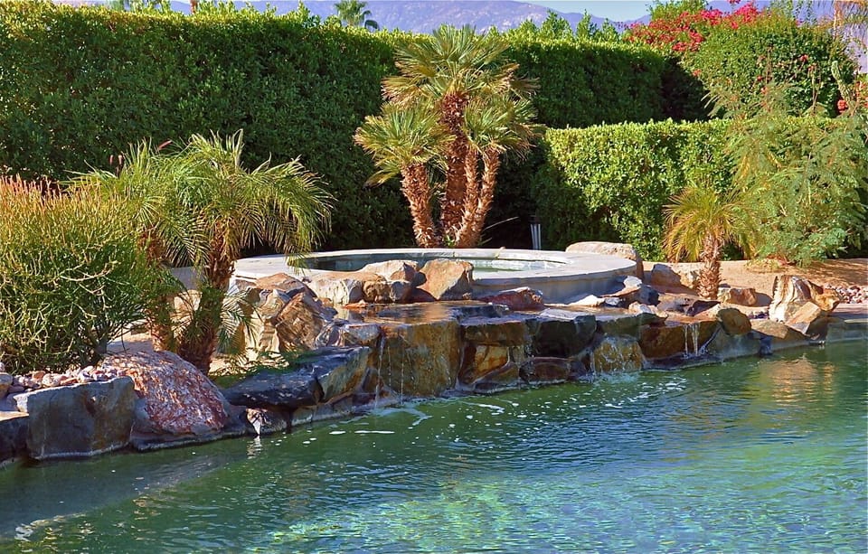 Spa, waterfall, pool.