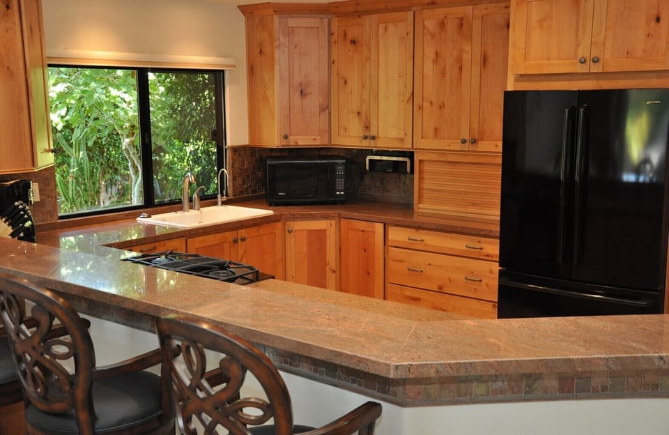 The kitchen has modern appliances and filtered water.