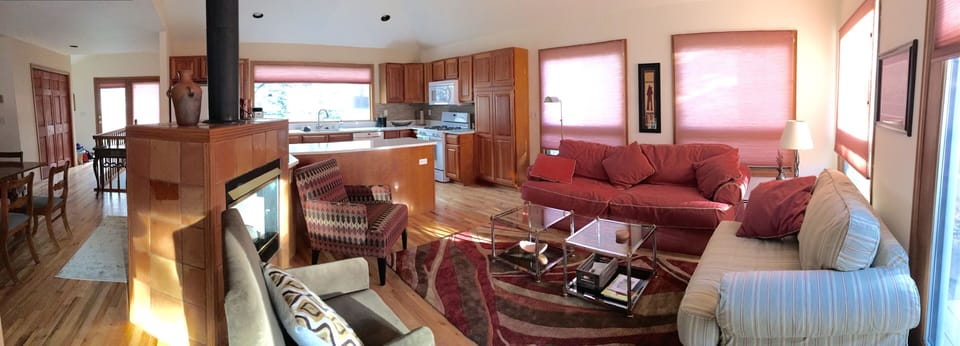 Panoramic view of open-concept living room, kitchen, and dining room...