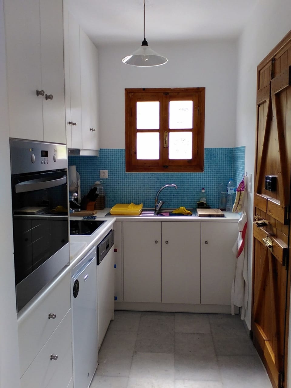 Main house kitchen area with dishwasher and oven