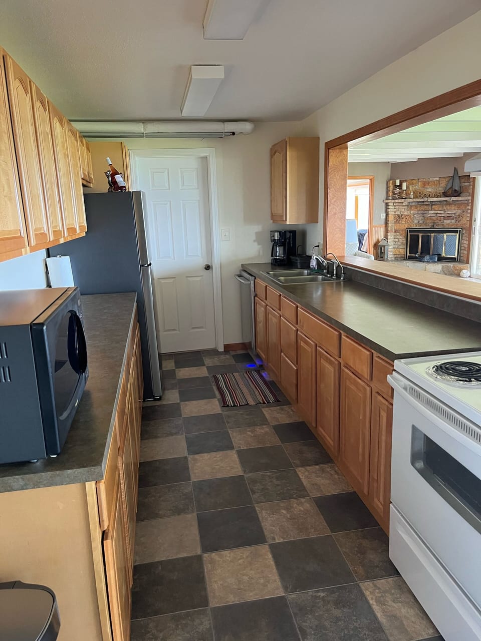 Full kitchen, with grill on private patio. 