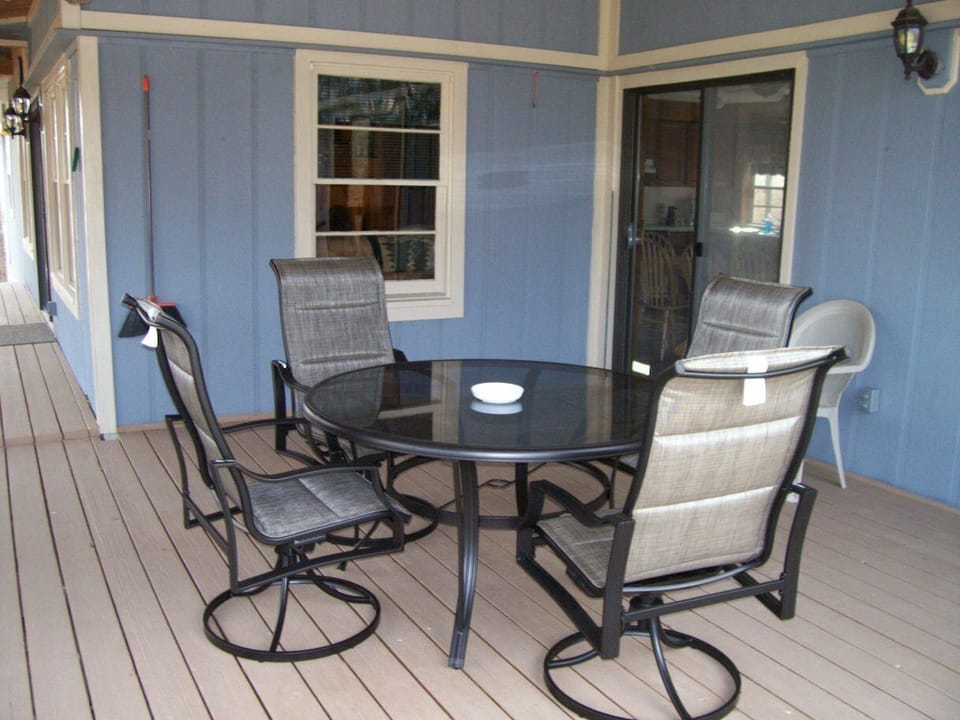 The beautiful, fan lit deck has lots of comfortable patio furniture.