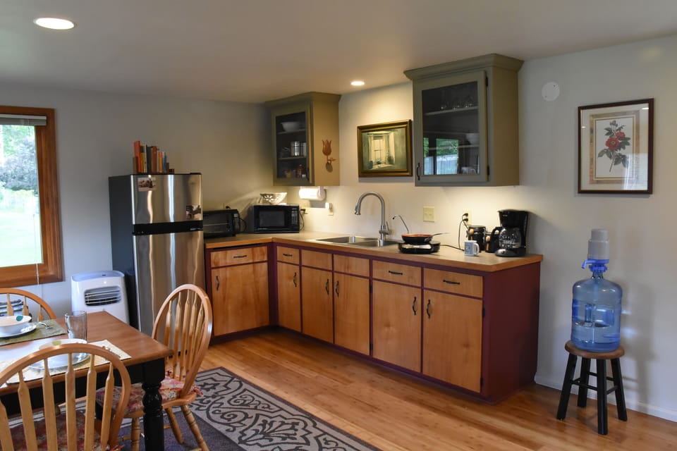 Zoning prohibits stove but there's toaster oven, microwave, & induction cook top