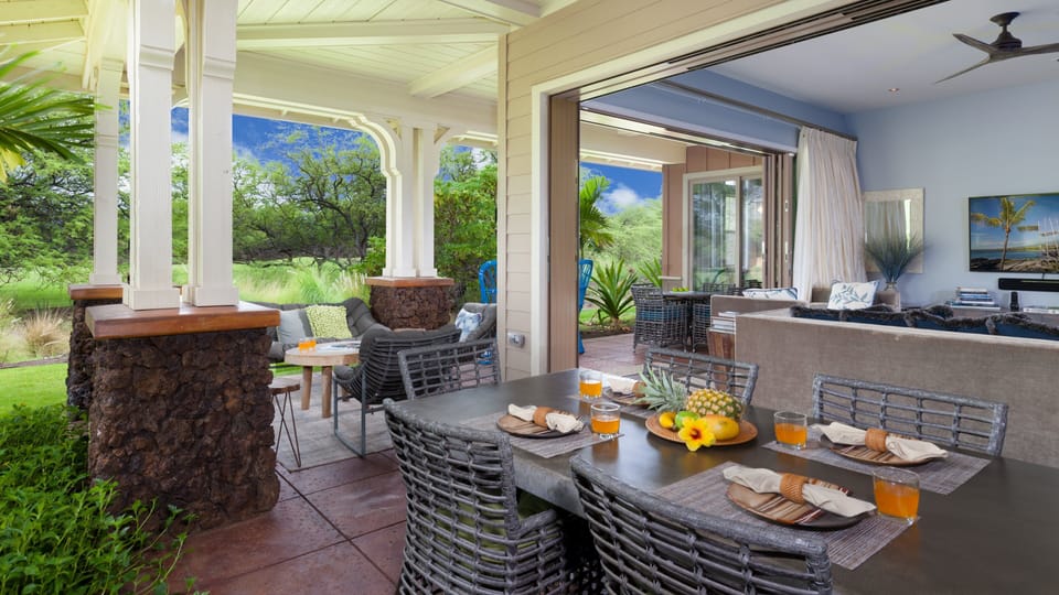 Spacious wrap around lanai with plenty of seating and outdoor dining table