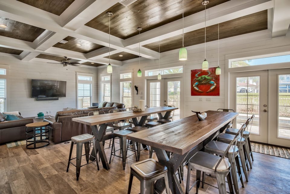 two 10-ft gathering tables, 2 sets of french doors lead to private pool