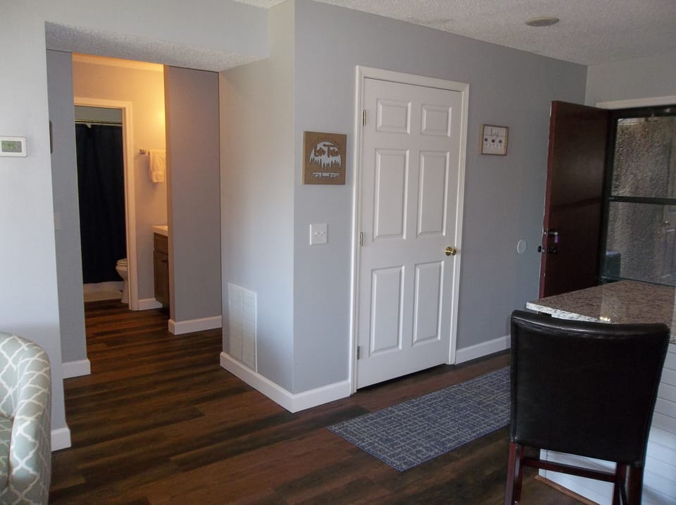 View of hallway leading to guest bedroom and bathroom, and master suite
