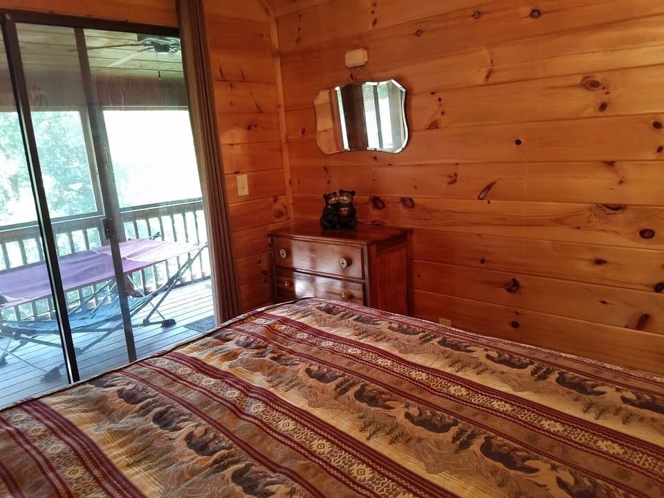 Master Bedroom: Sliding doors to screened in porch 