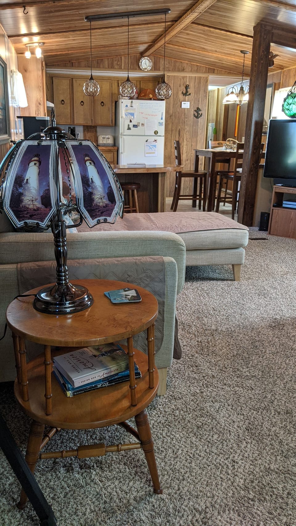 Spacious living room with leather couch and sectional. 