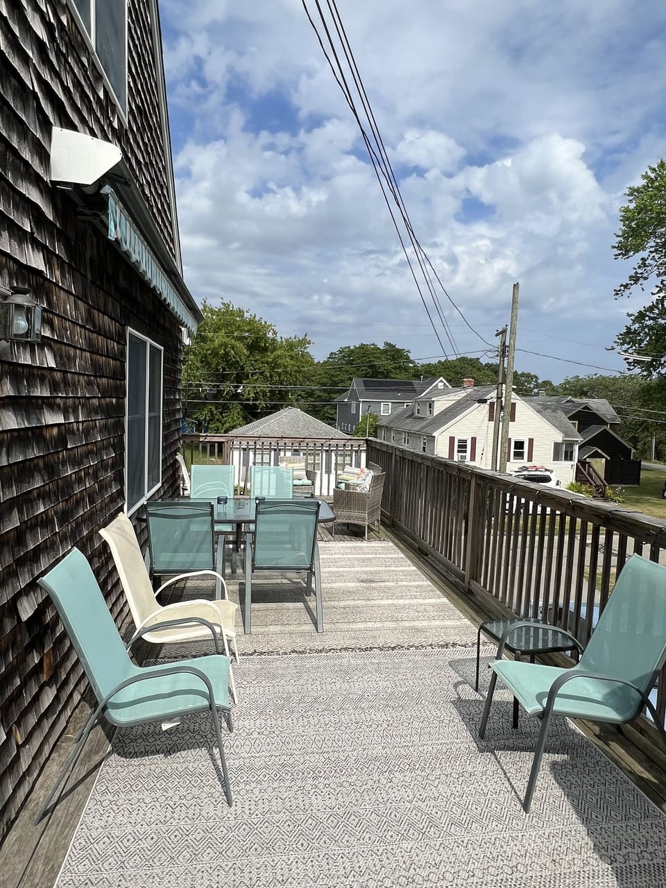 Outdoor deck space complete with table and chairs.