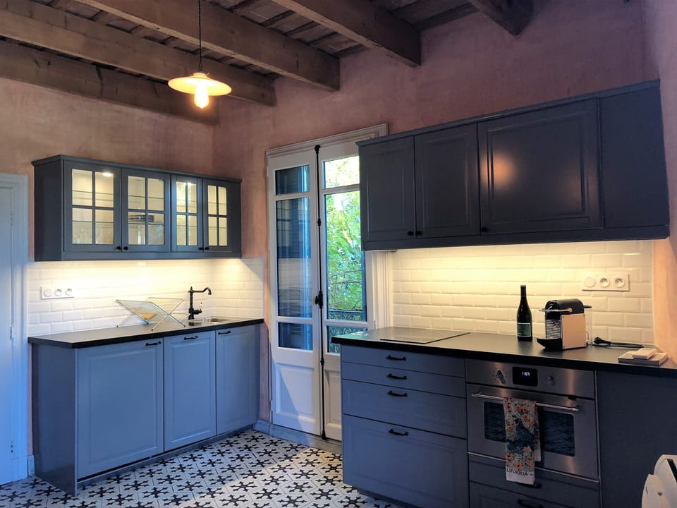 Kitchen has under-counter fridge, dishwasher and combo microwave/oven.