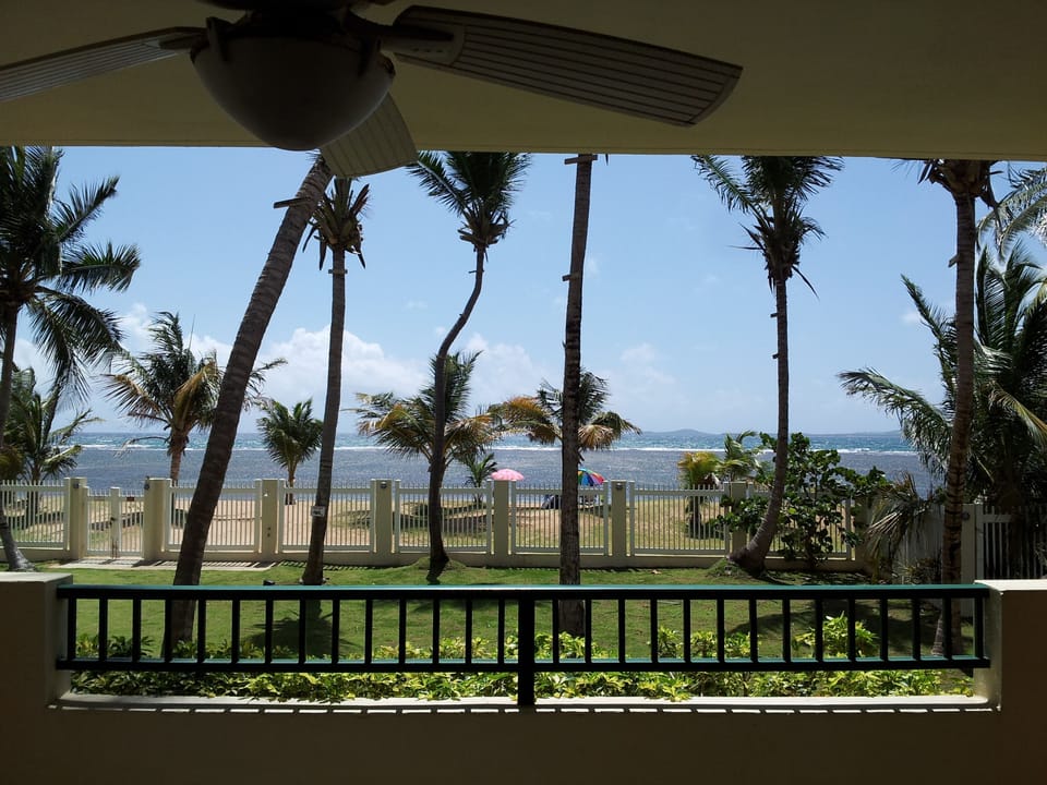 Terrace view to beach and private access gate.