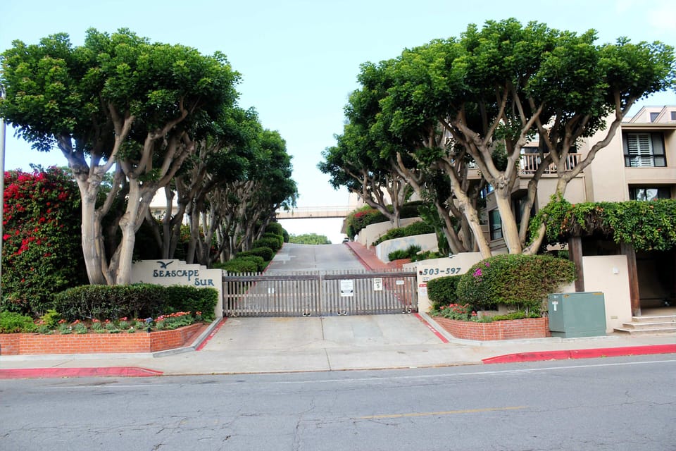 Main entry leads to gated parking