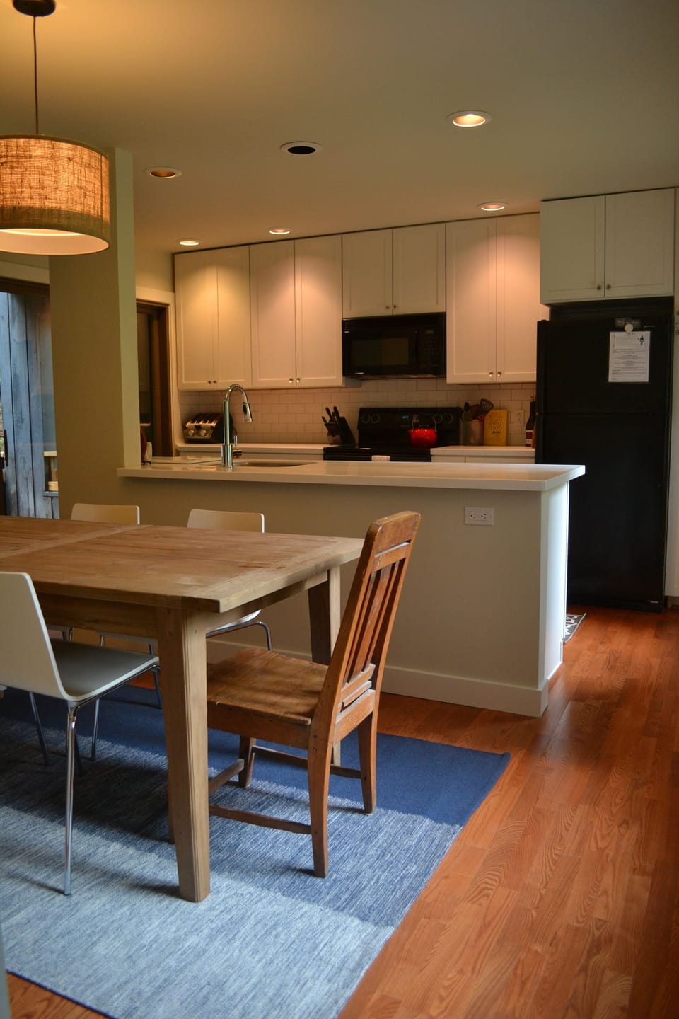 Modern Kitchen with new Corian counter tops, appliances, and dining area.