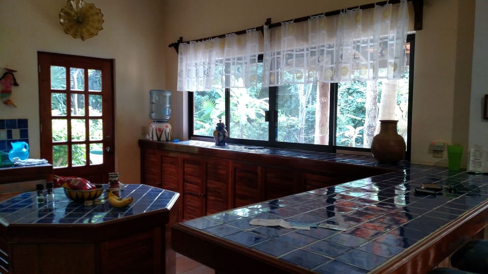 Kitchen facing the patio and pool- windows can pass through to patio.