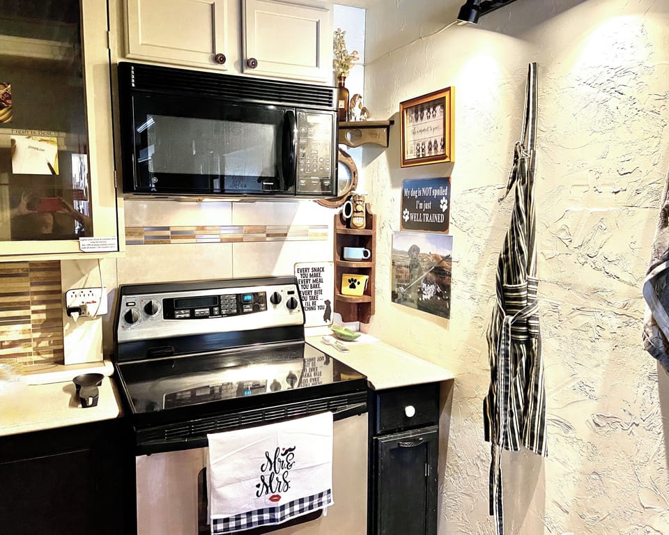 kitchen with stove and microwave 