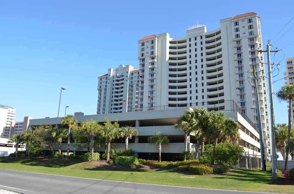 Beautiful Landscaping and gate entrance.  Reserved covered parking