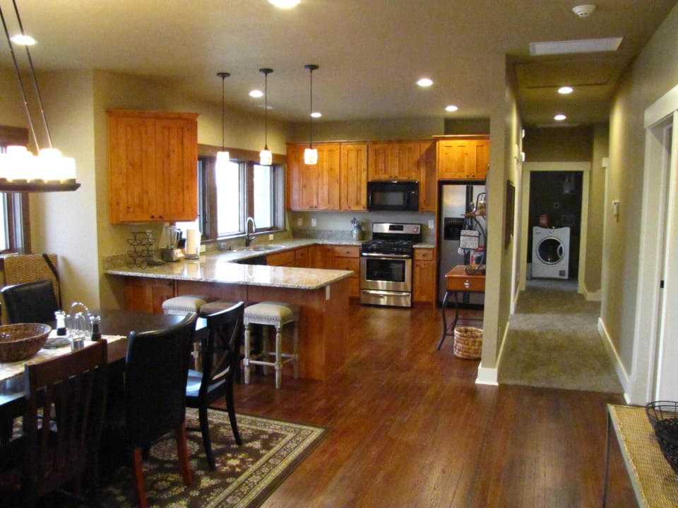 View across Dining, into kitchen and down hall to Laundry nook