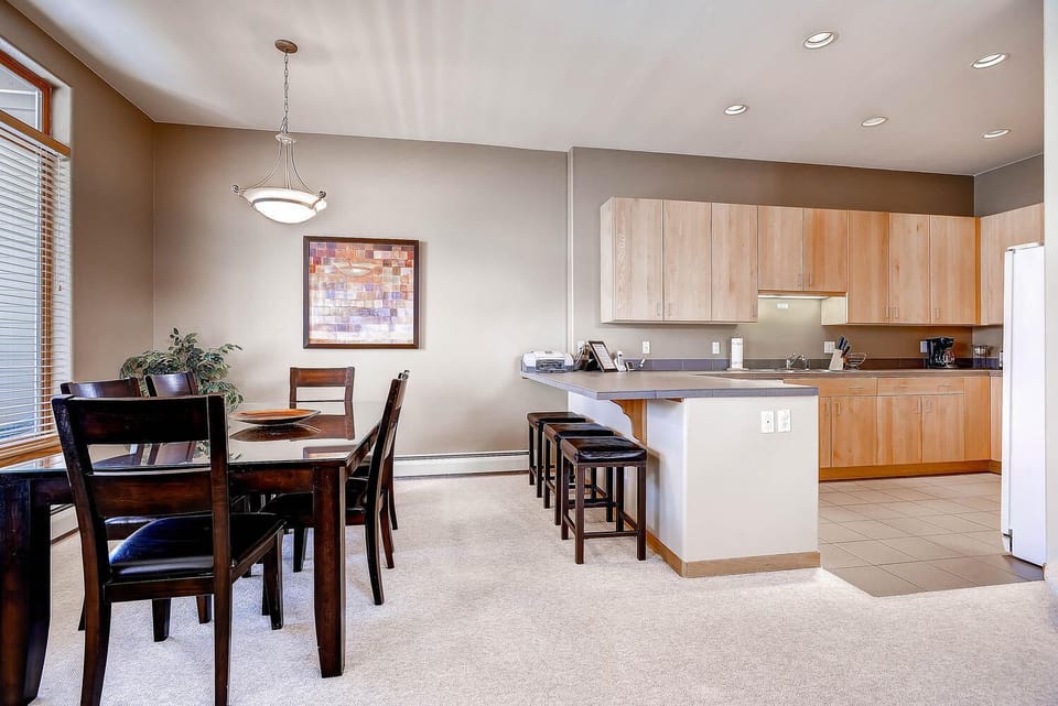 Open dining room and kitchen (old countertops and appliances shown)