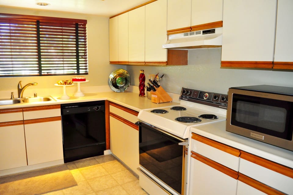 A fully stocked kitchen and ample space allows you to easily make and enjoy meals.