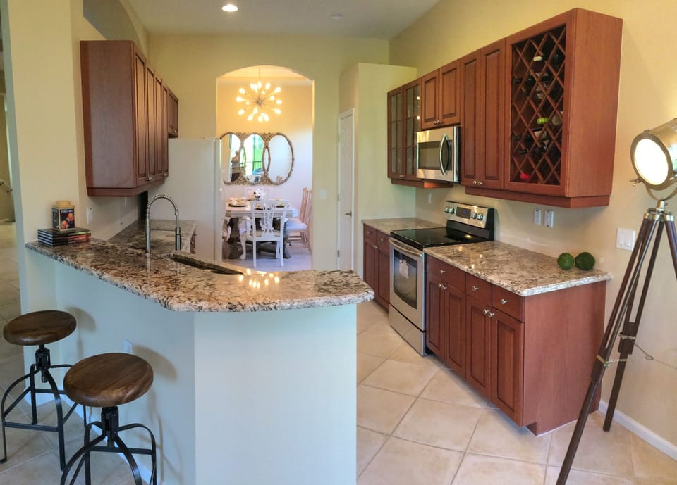 Open plan kitchen facing Lanai with a lake view