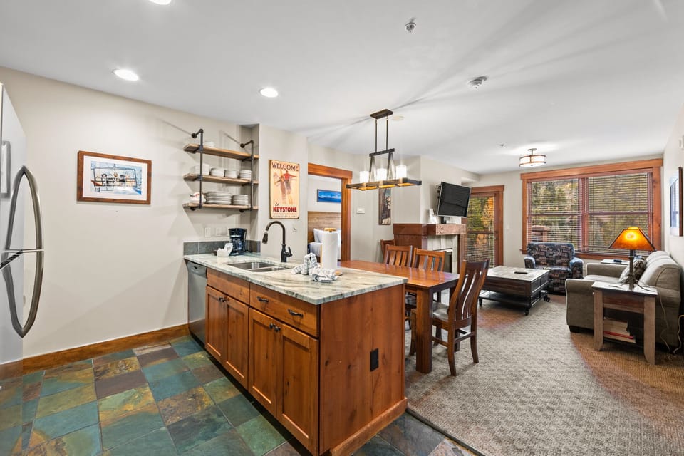 Unwind in your spacious open-concept suite with fully equipped kitchen, cozy dining nook, and comfortable living area perfect for relaxing evenings.