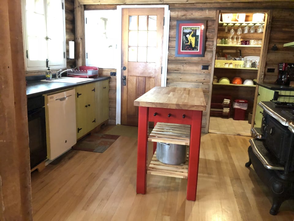 Kitchen, pantry room on right, door to back porch and terrace garden on left.