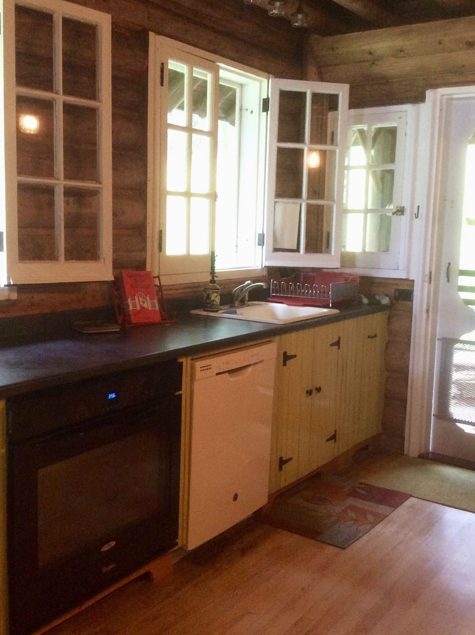Kitchen w/undercounter oven & dishwasher. Views of lake, side and back yard.    