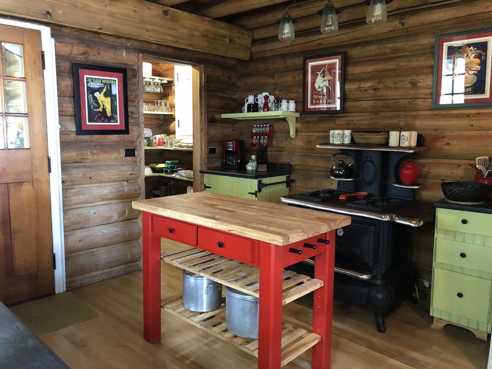 Kitchen with pantry room & butcher block island.