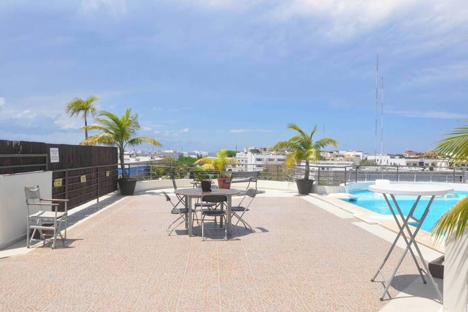 Enjoy sunset cocktails on the expansive rooftop sun terrace.