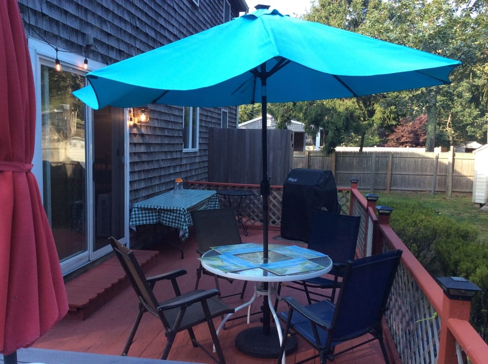 Another view of wrapped around deck with outdoor lighting
