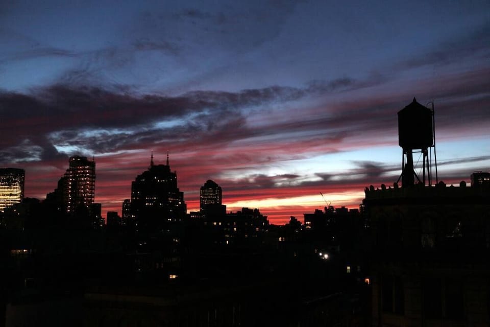 Sunset views every night of Freedom tower and art deco downtown Manhattan 