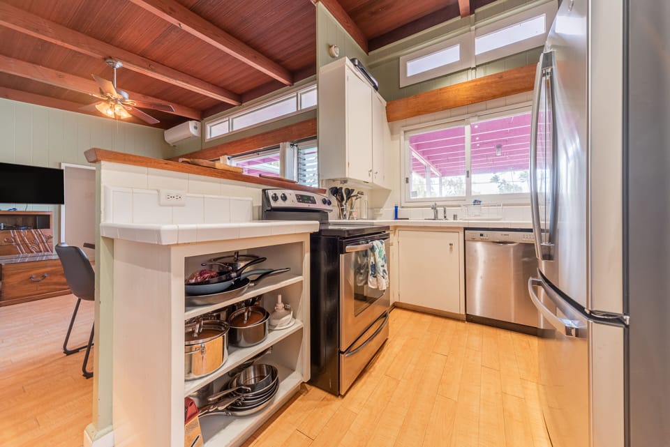 Kitchen with refrigerator, stove, and dishwasher. 