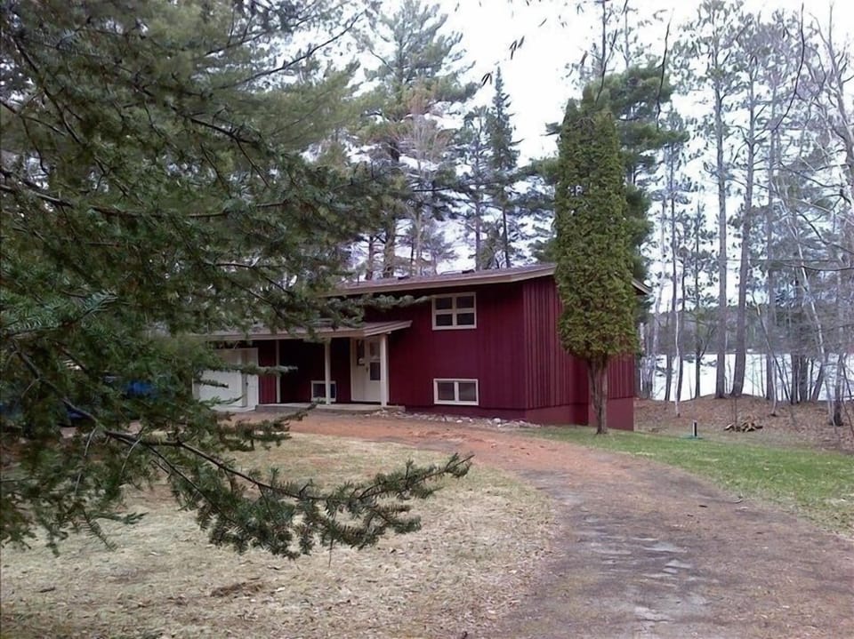 Yard view in early spring.  Now landscaped with trees, shrubs and flowers.