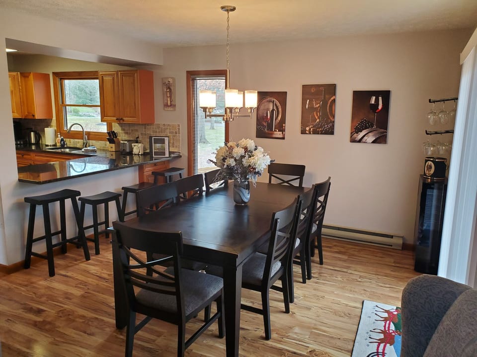 Dining table has seating for 8  and 4 at the counter complete  w/wine chiller