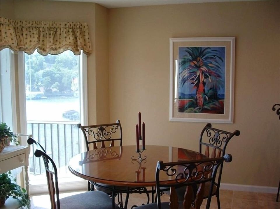 Dining room overlooks the lake. Have dinner while watching a beautiful sunset.