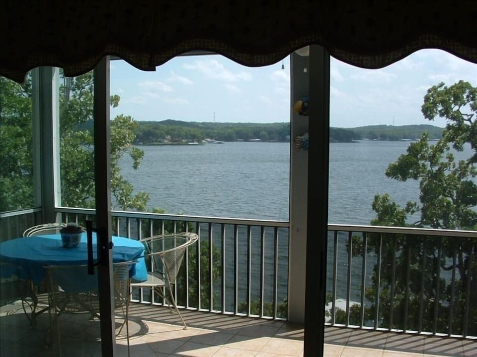 Large screened balcony on the lake. Also has a rocking chair and porch swing.
