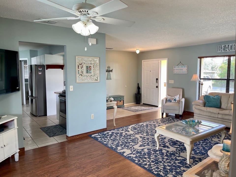 Large TV in corner can be viewed from all areas of living room