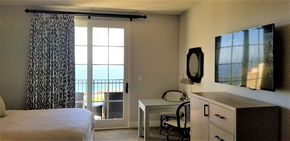 Two Queens Guestroom with Large HDTV, Desk and OceanView Balcony