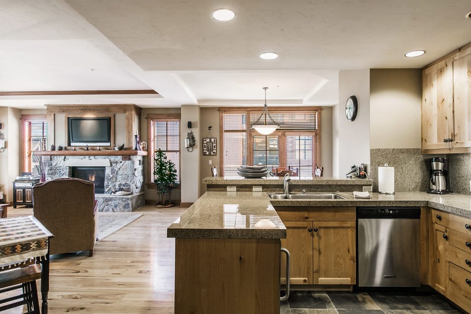 Bright kitchen looking out onto the balcony and living room.