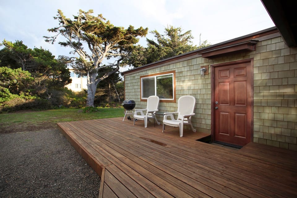 Back deck with Weber grill and deck chairs
