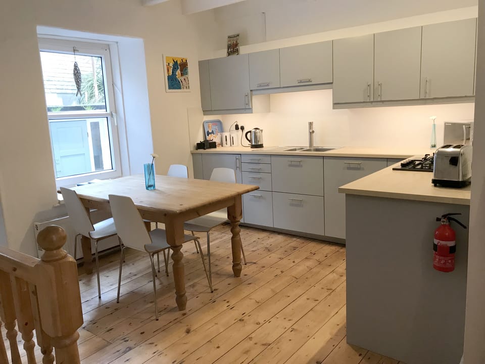 Kitchen with dishwasher. There are 6 chairs so the whole family can eat together