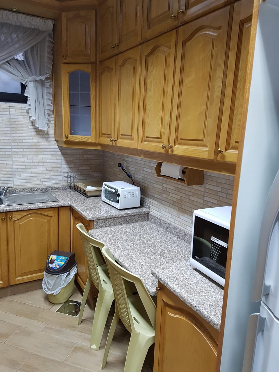 Breakfast area in the kitchen with toaster oven and microwave 