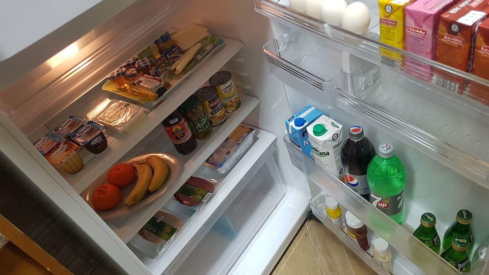 Fridge full of breakfast essentials and fruits 
