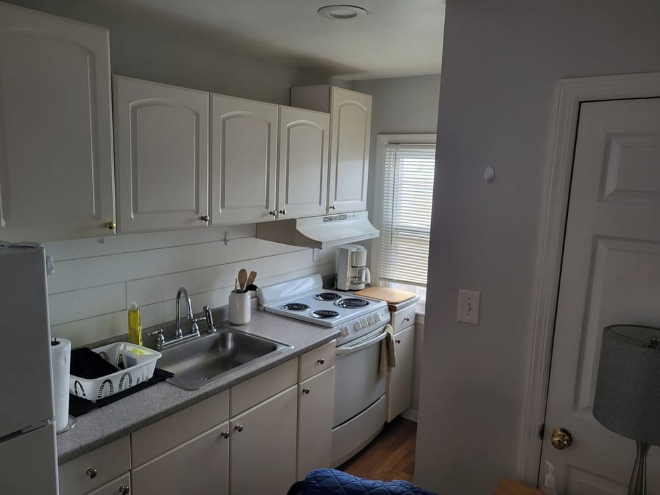 Galley kitchen is fully-equipped.