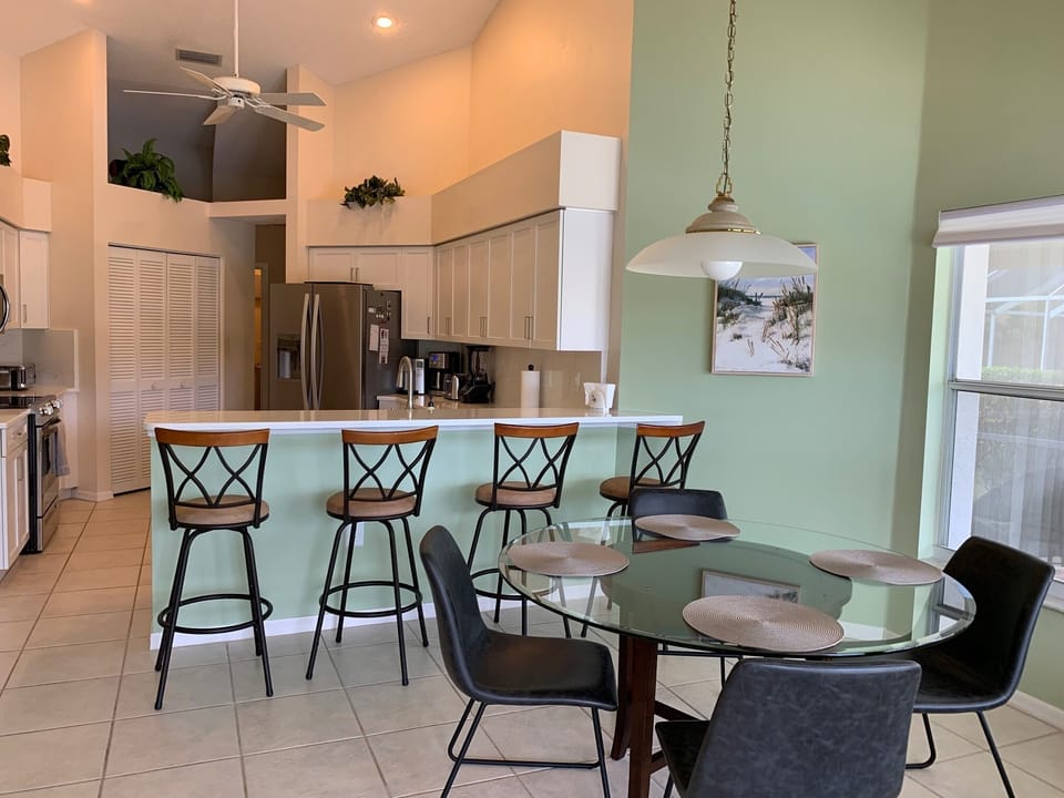 Kitchen with eating area open to the family room and lanai.