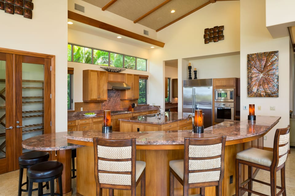 Expansive Bordeaux granite topped bar, counters and kitchen island 