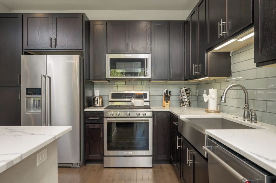 Stainless steel ample appliances with abundant cooking space.