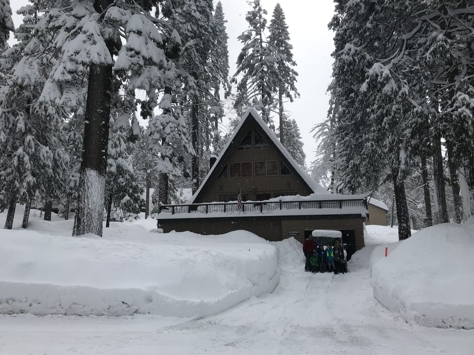 Front of cabin in snow.